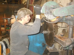 guy looking at saw blade